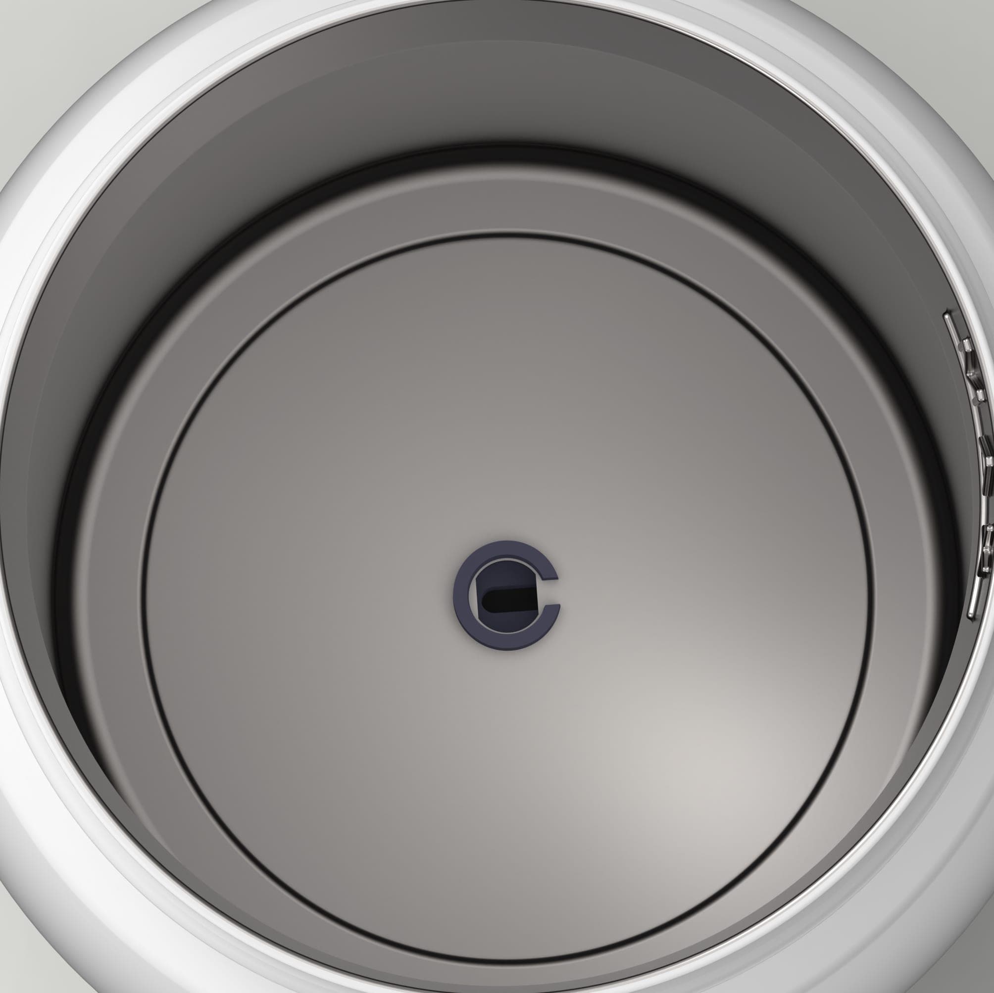 Looking straight down into the empty stainless steel chamber