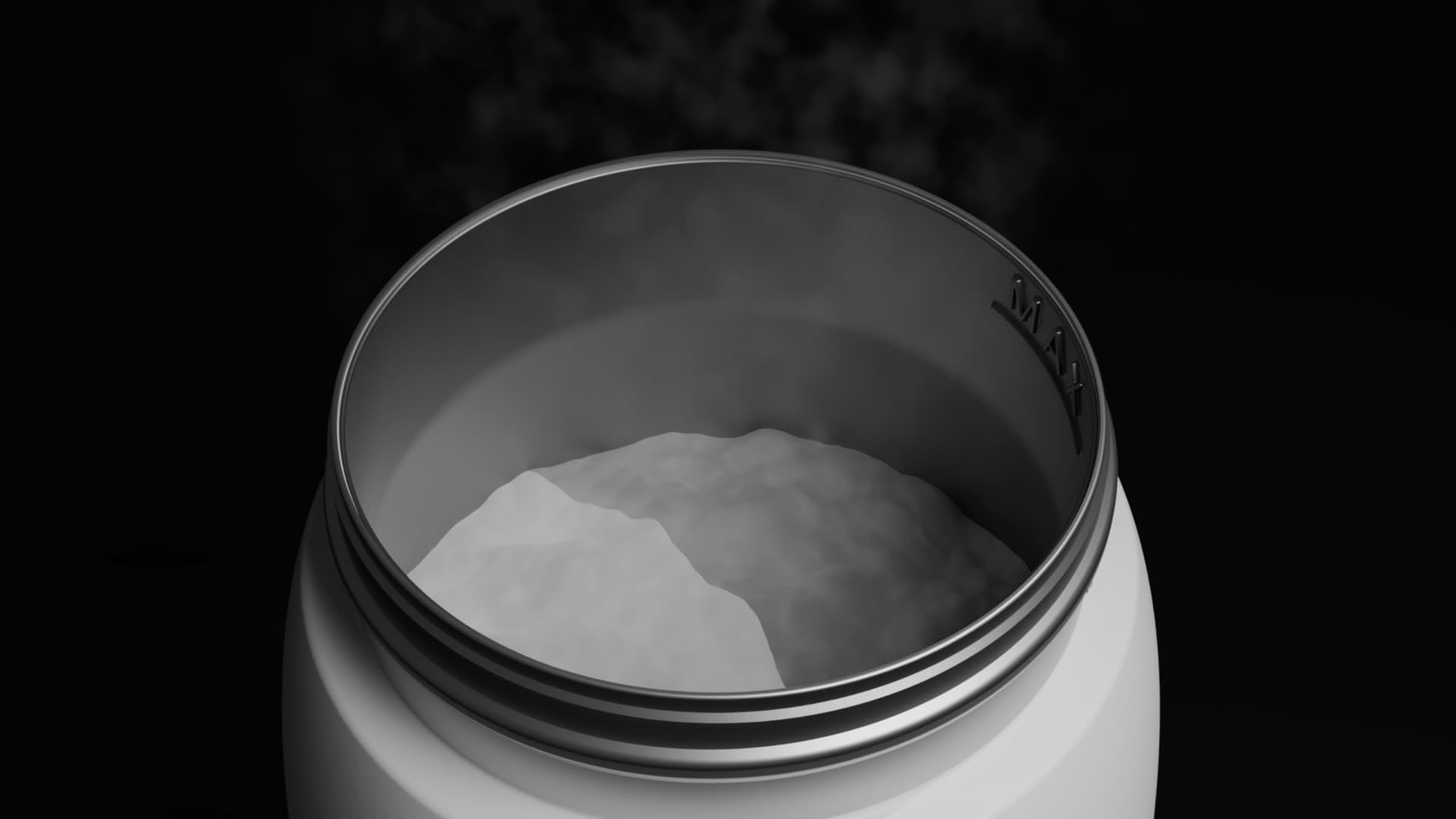The warmer on black silk: the bottle revealed, the lid opening, and water churning in the chamber